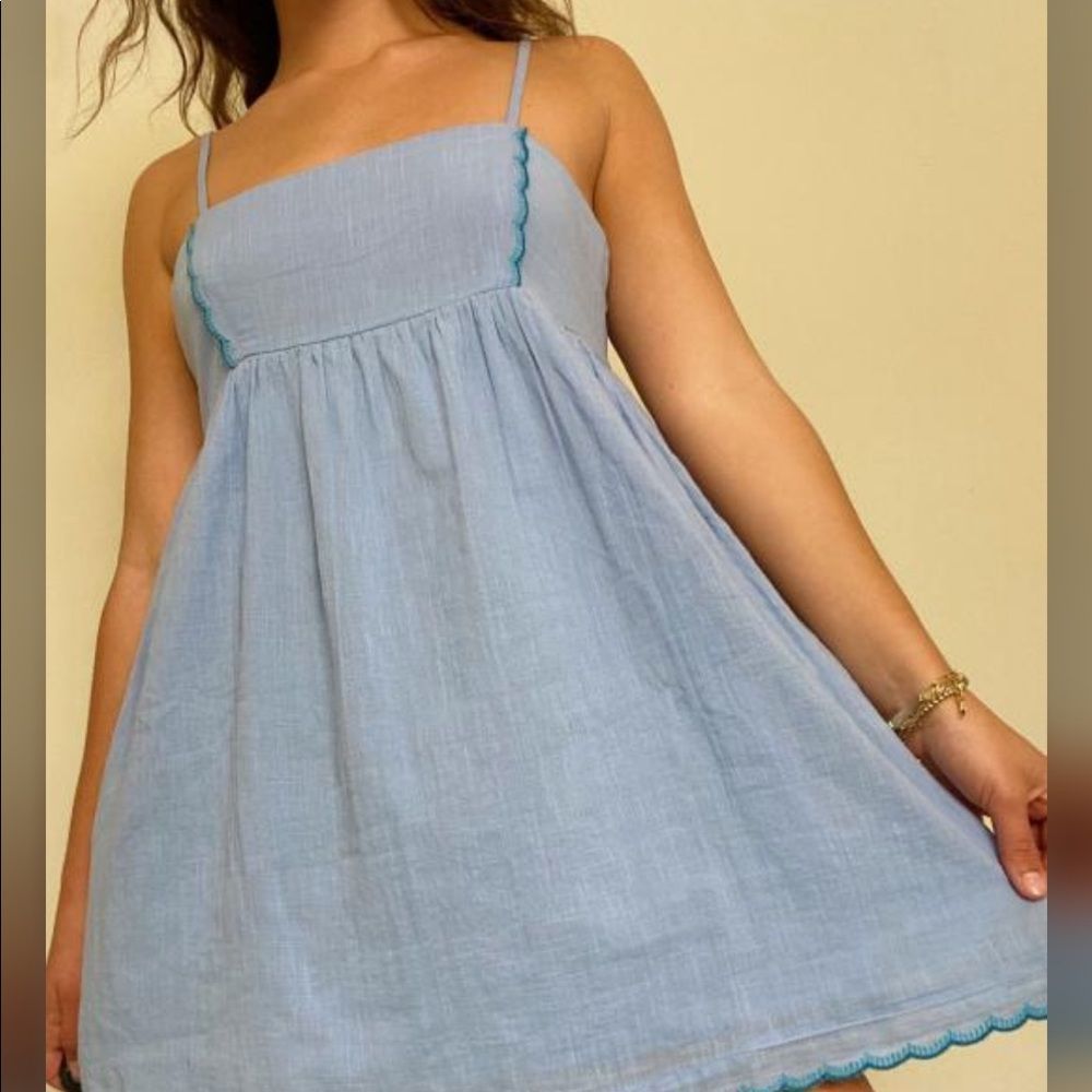 Urban outfitters
Sweetly styled  mini Dress Zipper at the side.Sz M